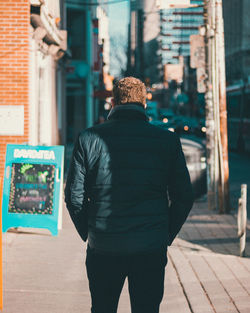 Rear view of man standing outdoors