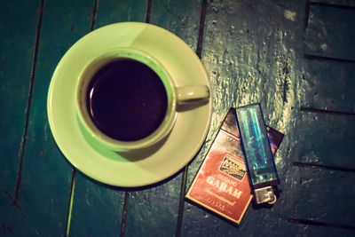 High angle view of coffee cup on table