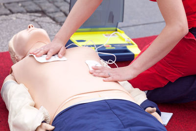 Midsection of couple sitting in hands