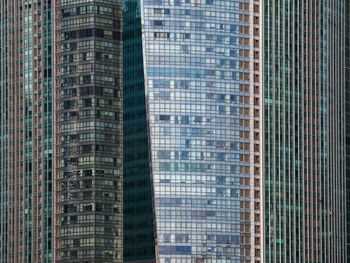 Low angle view of skyscrapers against sky