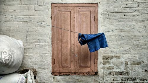 Umbrella on window of old building