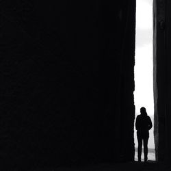 Silhouette people standing against tree