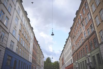 Low angle view of buildings in city against sky