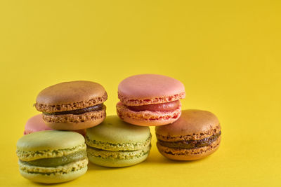 Close-up of birthday cake against yellow background