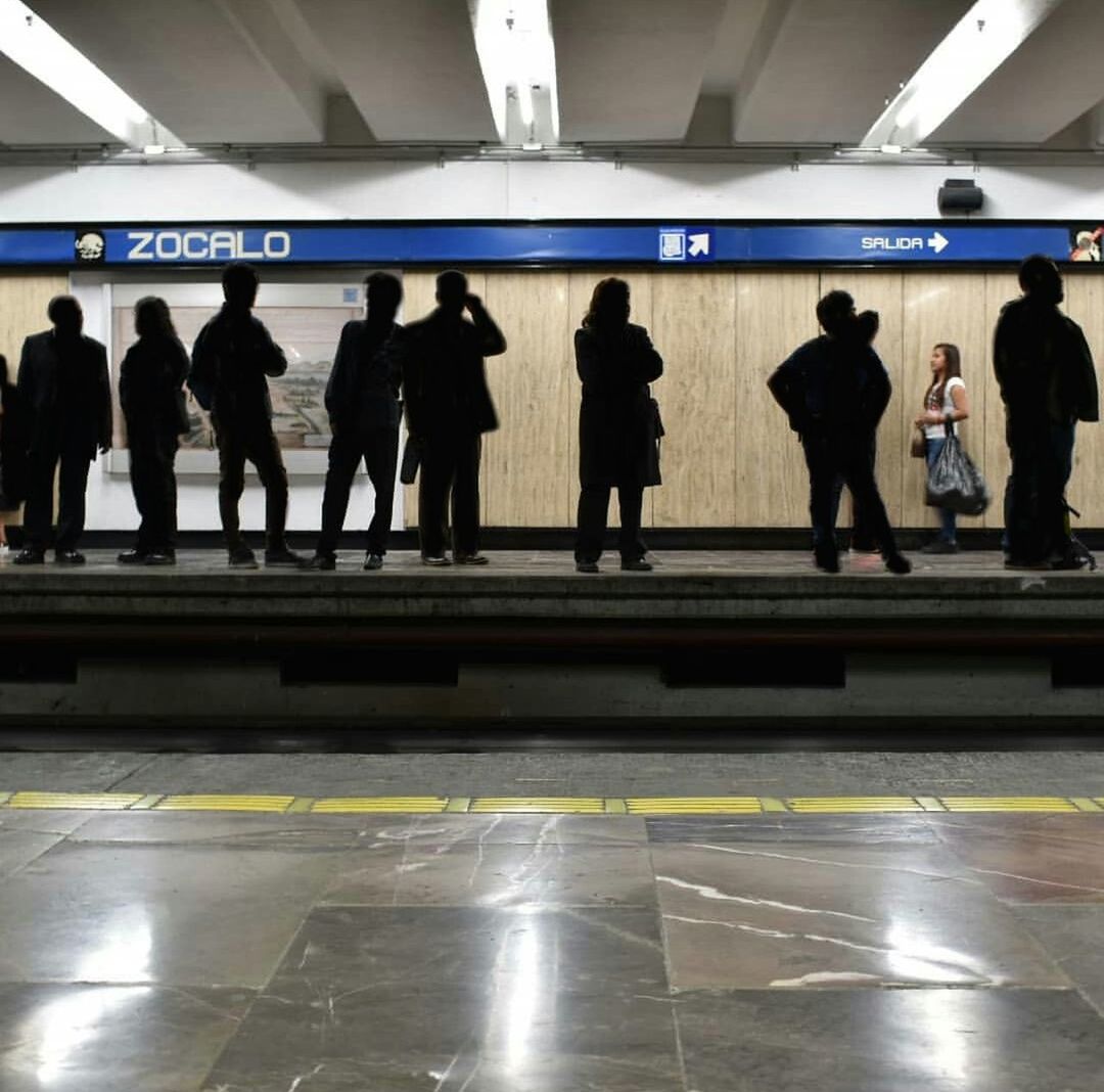 group of people, transportation, rail transportation, public transportation, indoors, subway station, travel, waiting, mode of transportation, real people, men, medium group of people, architecture, crowd, subway, illuminated, group, tiled floor, station