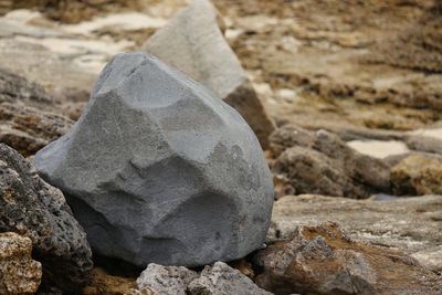 Close-up of weathered stone tool stack on rock