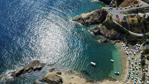 High angle view of rocks on sea shore