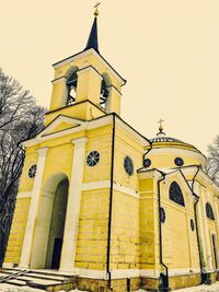 Low angle view of bell tower against sky