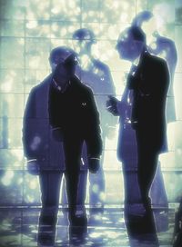 Woman standing in the dark