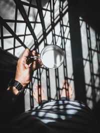 High angle view of man holding glass of milk