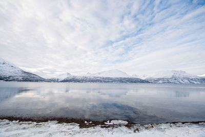 Scenic view of frozen lake against sky