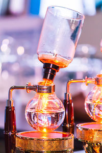 Close-up of glass bottle on table