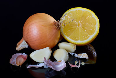 Close-up of lemon slice against black background