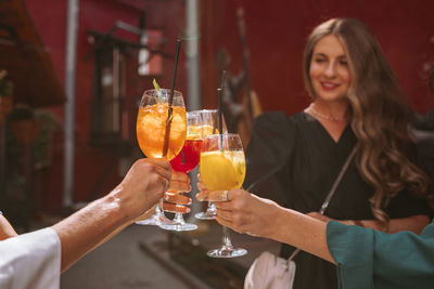 Young woman drinking beer at glass