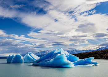 Scenic view of frozen lake against sky