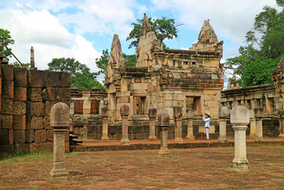 Old temple building against cloudy sky