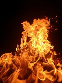 Close-up of fire against black background