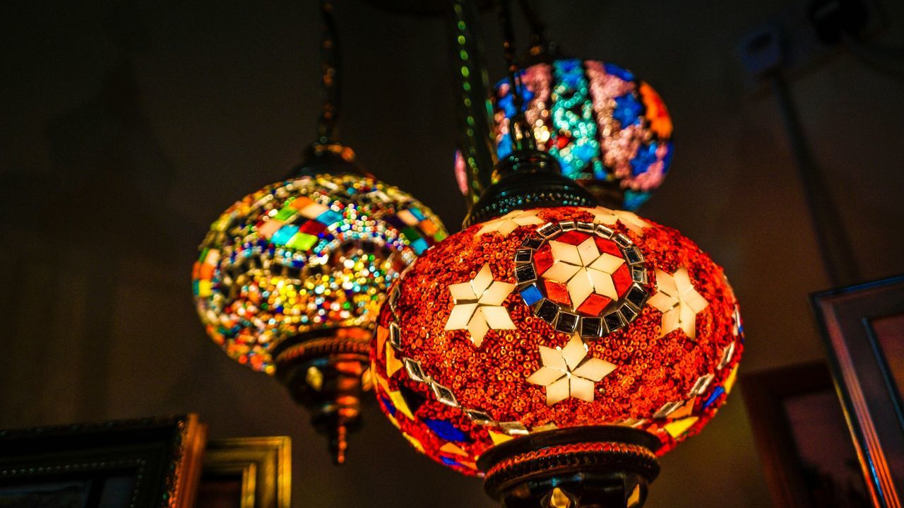 illuminated, decoration, indoors, hanging, lighting equipment, art and craft, multi colored, art, tradition, low angle view, creativity, lantern, christmas, ornate, design, night, ceiling, cultures, christmas decoration, celebration