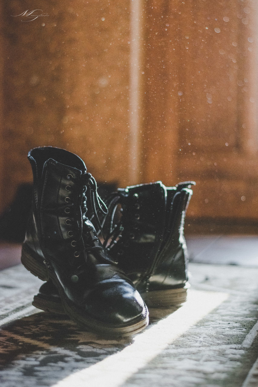 HIGH ANGLE VIEW OF SHOES ON WOOD