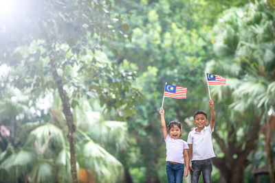 Rear view of couple standing in flag