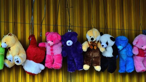 Teddy bears hanging for sale at market