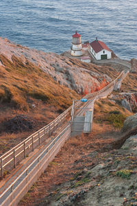 High angle view of road by sea against buildings