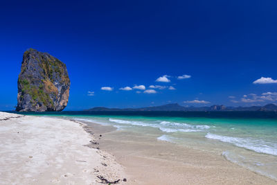 View of beach against blue sky