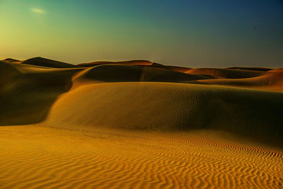 Scenic view of desert against clear sky