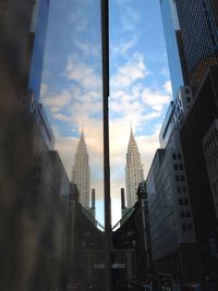 Low angle view of modern buildings against sky