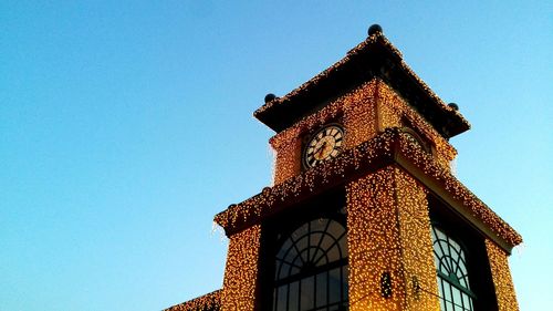 Low angle view of building against blue sky