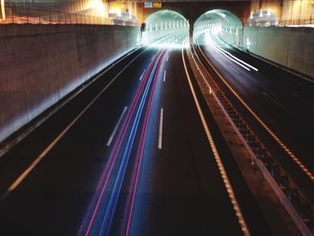 Light trails on road in city at night