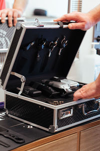 Cropped hands of man using sound mixer