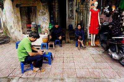 Men sitting on floor