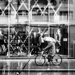 Man riding bicycle on city