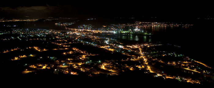 High angle view of illuminated buildings in city at night