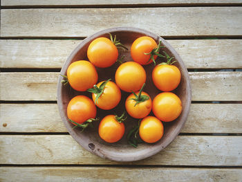 High angle view of oranges on wooden table