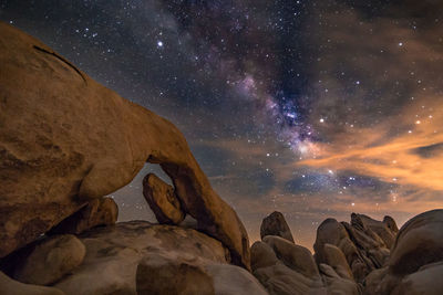 Scenic view of rocks at night