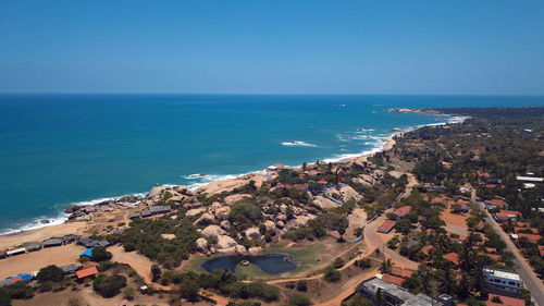 High angle view of sea against clear blue sky