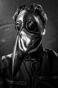 Close-up portrait of man wearing mask