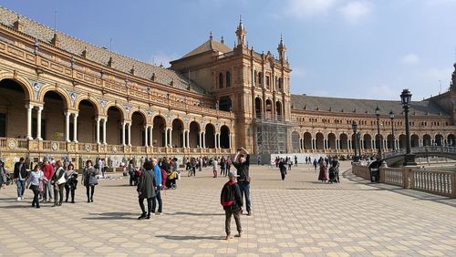 People in front of historical building