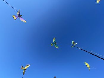 Low angle view of helicopter flying in sky
