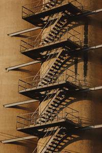 Low angle view of staircase in building against sky