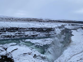 Scenic view of sea against sky during winter