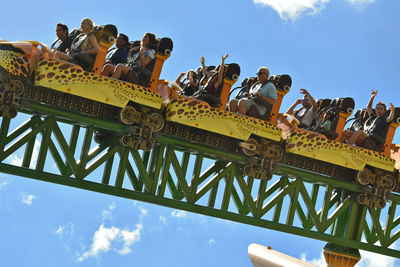 Low angle view of carousel against sky