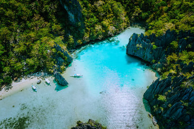 High angle view of rocks by sea