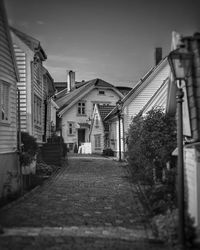 Street amidst buildings against sky