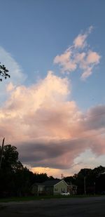 Scenic view of buildings against sky during sunset