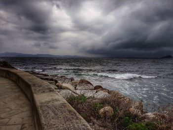 Scenic view of sea against cloudy sky