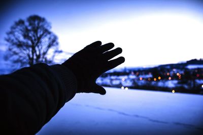 Silhouette of person against blue sky