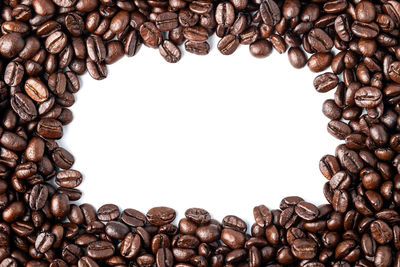 Close-up of coffee beans against white background
